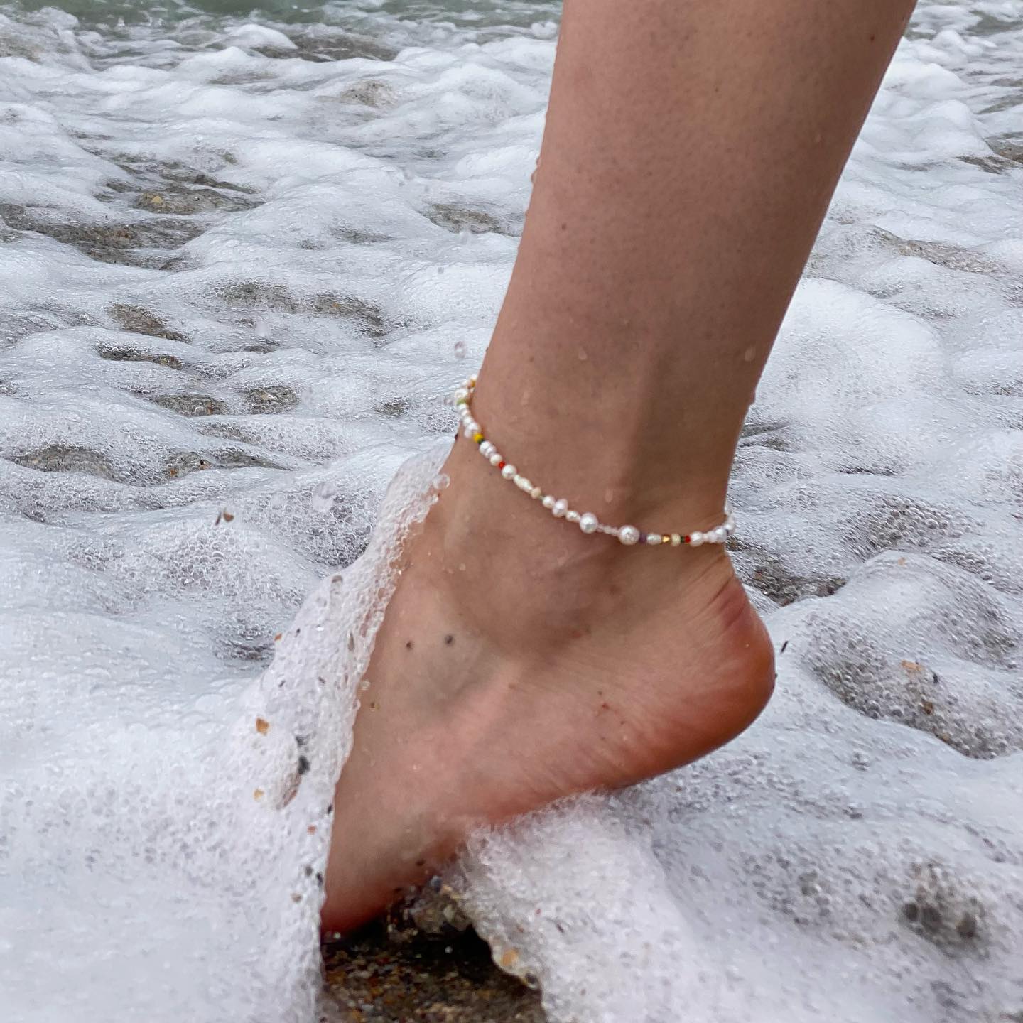 Pearl anklet in the sea foam